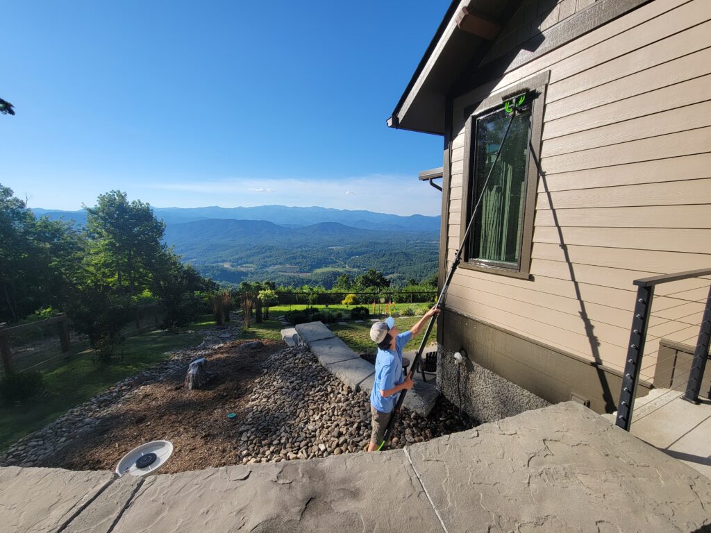 Cleaning an exterior window with a waterfed pole